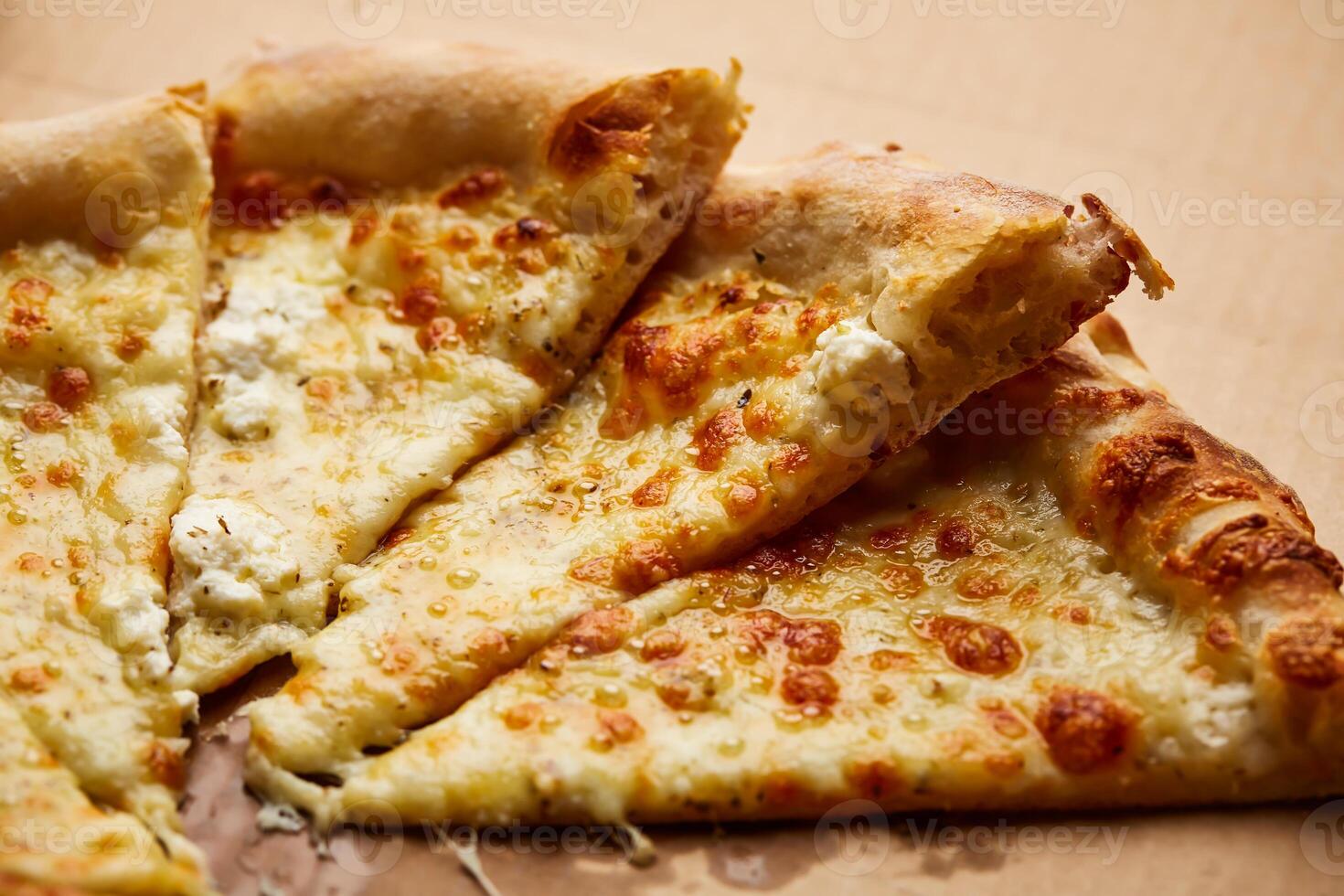 White Pie Pizza Slice closeup isolated on dark background with raw food top view of italian fastfood appetizer photo