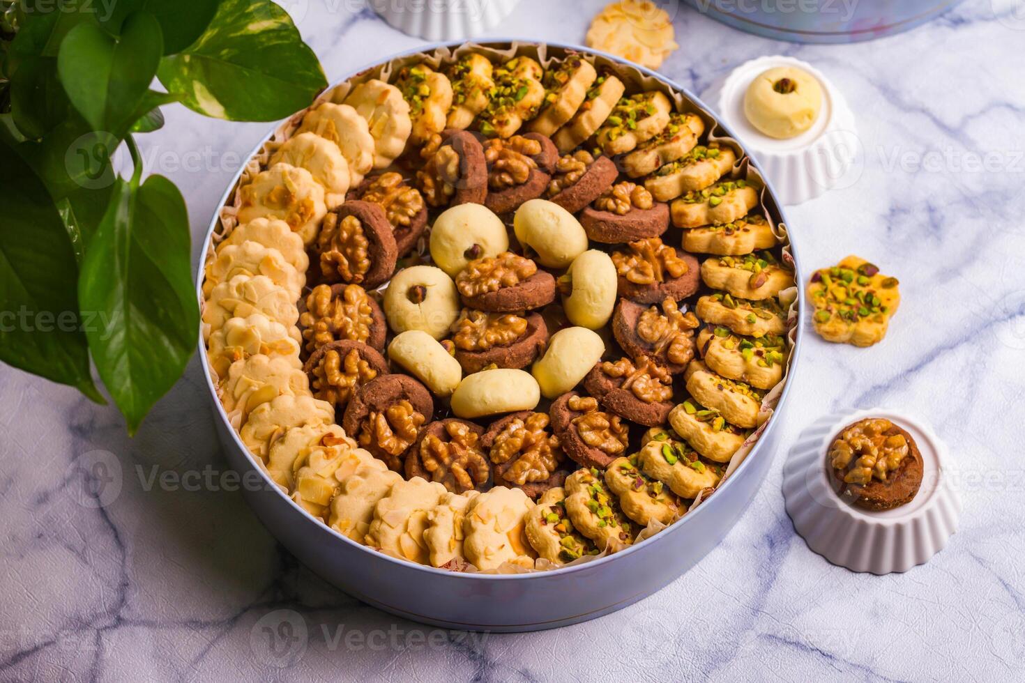 Assorted sweets biscuit served in a dish isolated on grey background top view of desserts photo