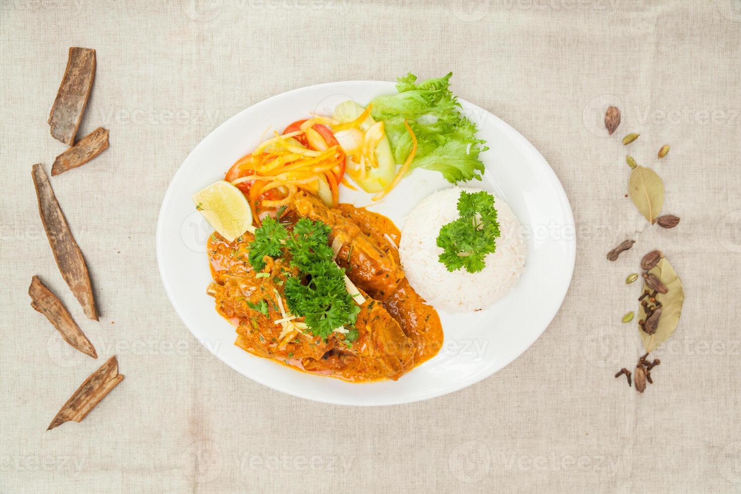 Mutton Rara gosth with plain rice, salad and lime served in a dish isolated on table top view of indian spices food photo
