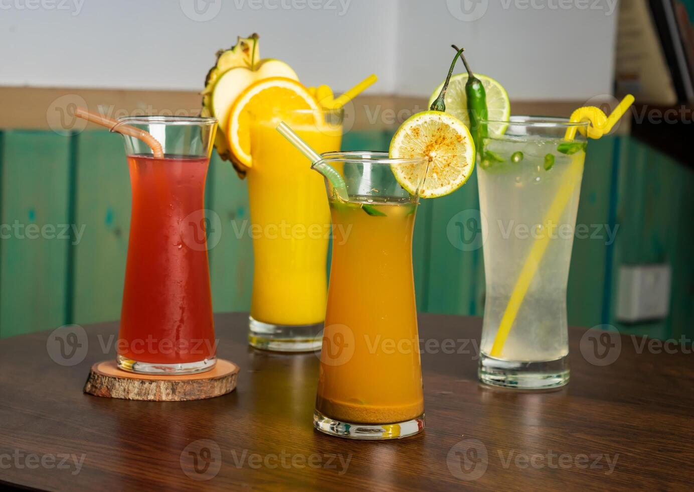 A glass of watermelon juice shake with Spicy Lemonade, raw watermelon, straw isolated on wooden table side view healthy drink for vitamin c photo