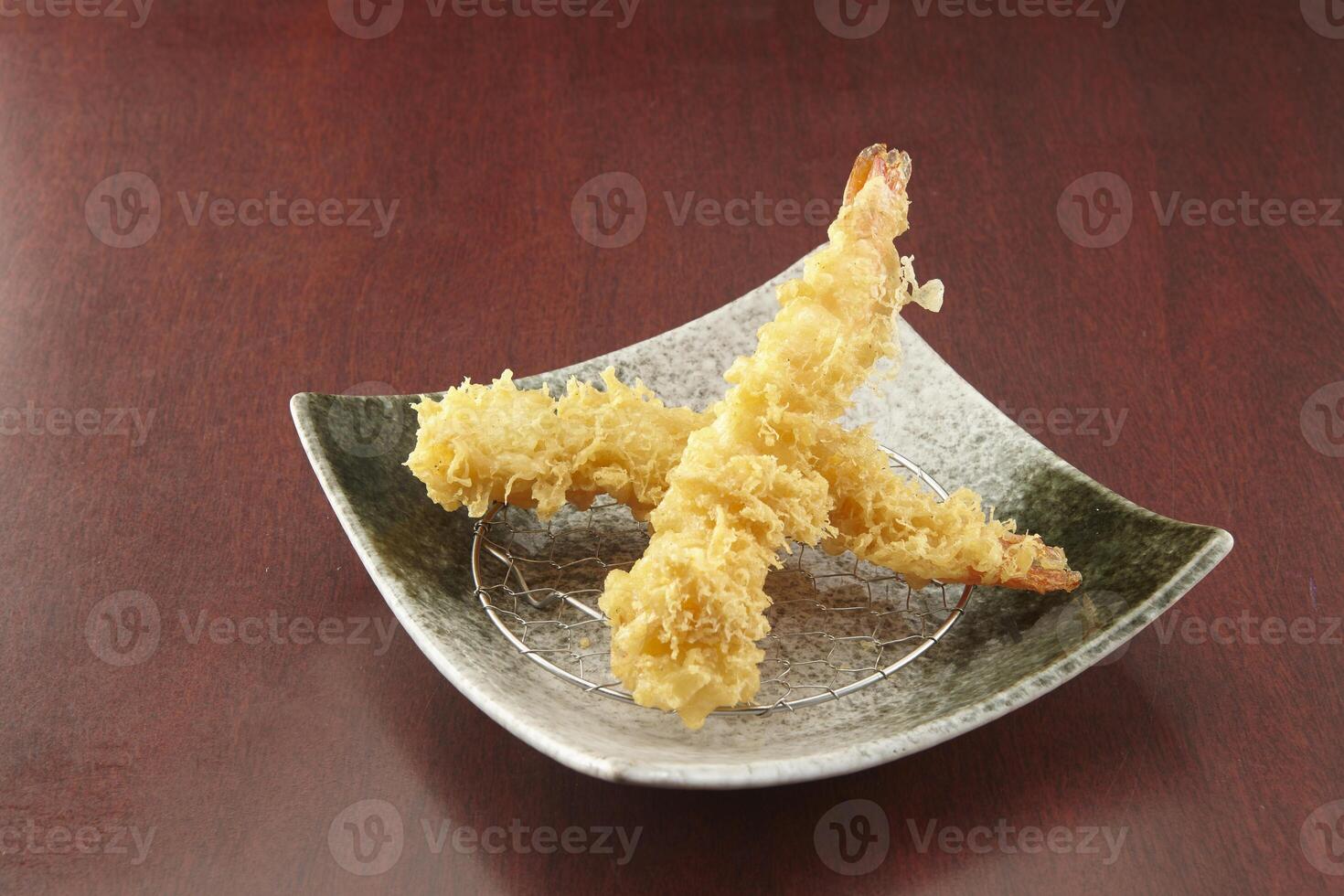 deep fried ebi served in a dish isolated on wooden table side view of singapore food photo