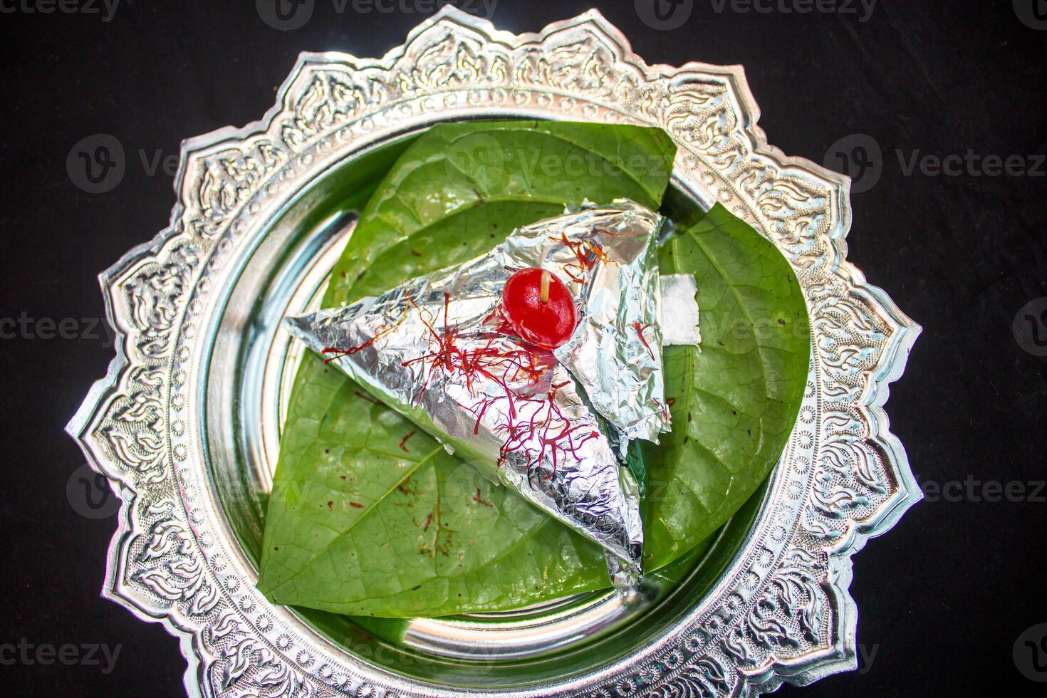 Special meetha paan masala isolated on Betel leaf top view photo