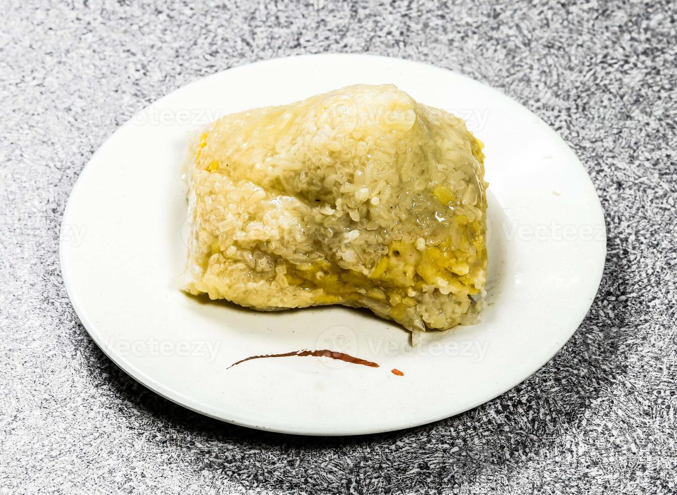 egg yolk bacon dumpling served in bowl isolated on background top view of hong kong food photo