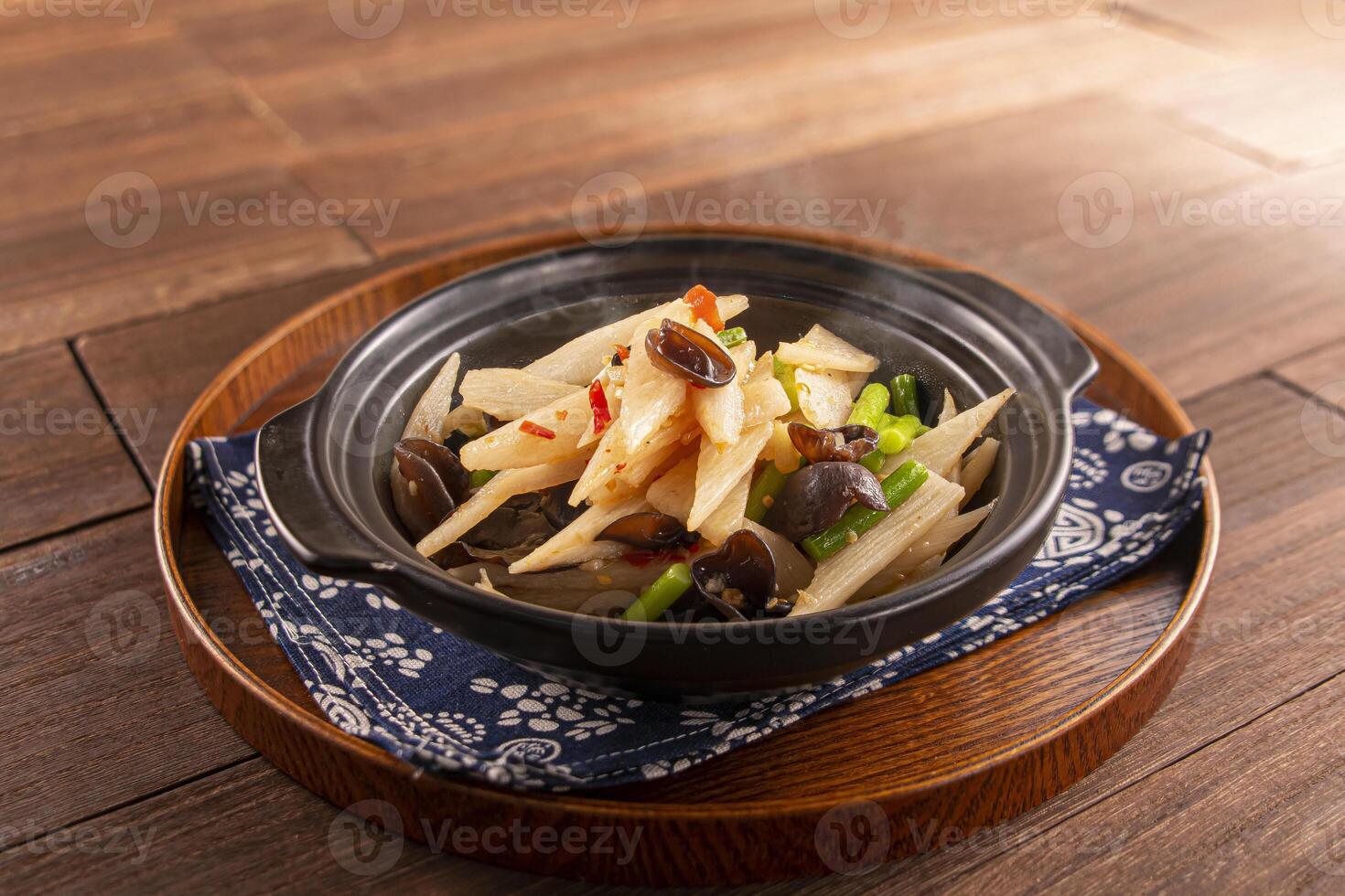 Chinese yam casserole with garlic core and black fungus served dish isolated on wooden table top view of Hong Kong food photo