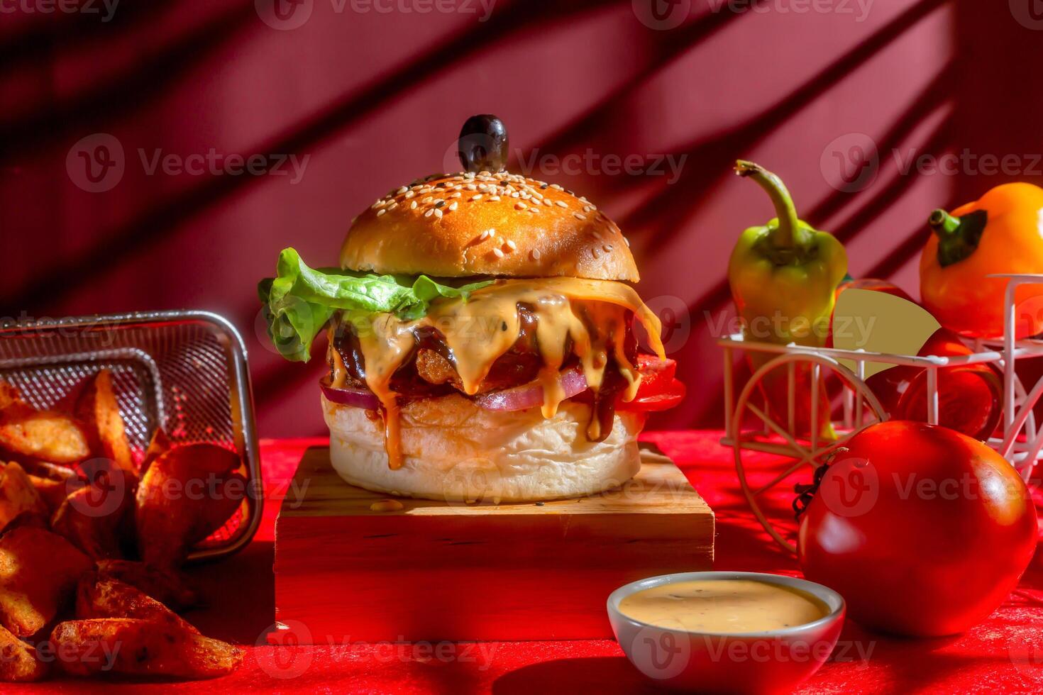 Tongue Twister Beef Naga burger with fries and tomato slice isolated on wooden board side view of american street food photo