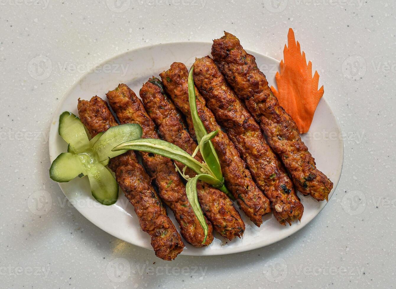 Spicy bbq chicken reshmi kabab served in a dish isolated on grey background top view of indian, pakistani food photo