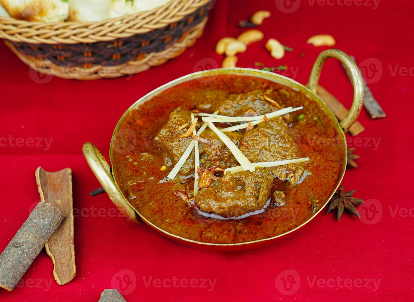 Beef Bhuna korma masala rogan gosht with bread served in karahi isolated on table top view of indian, pakistani and punjabi spicy food photo