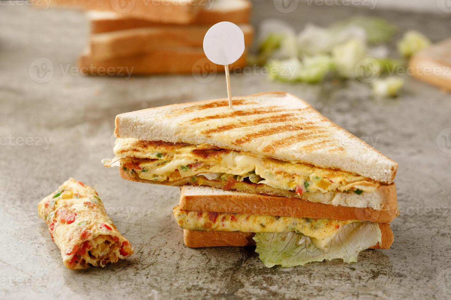 Cheesy Omelette Sandwich served in a dish isolated on grey background side view fast food photo