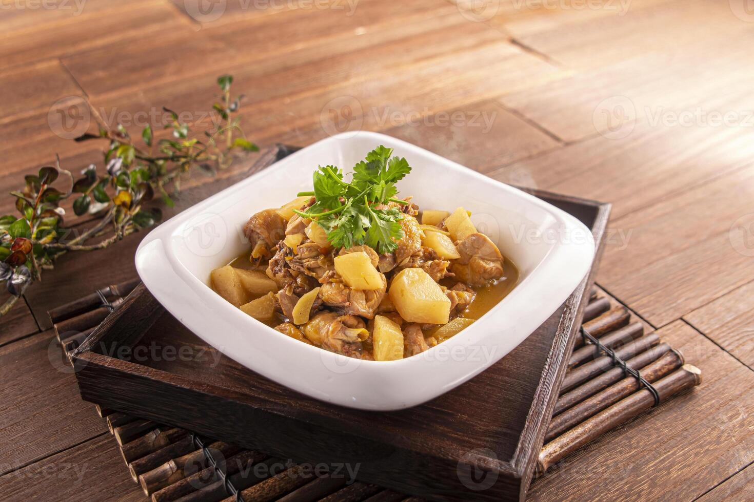 Braised Chicken with Sour Radish served dish isolated on wooden table top view of Hong Kong food photo