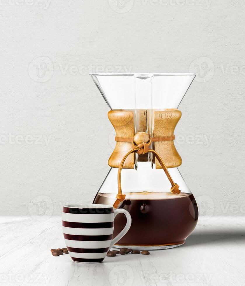 CHEMEX COFFEE maker filter with black coffee cup isolated on table side view photo