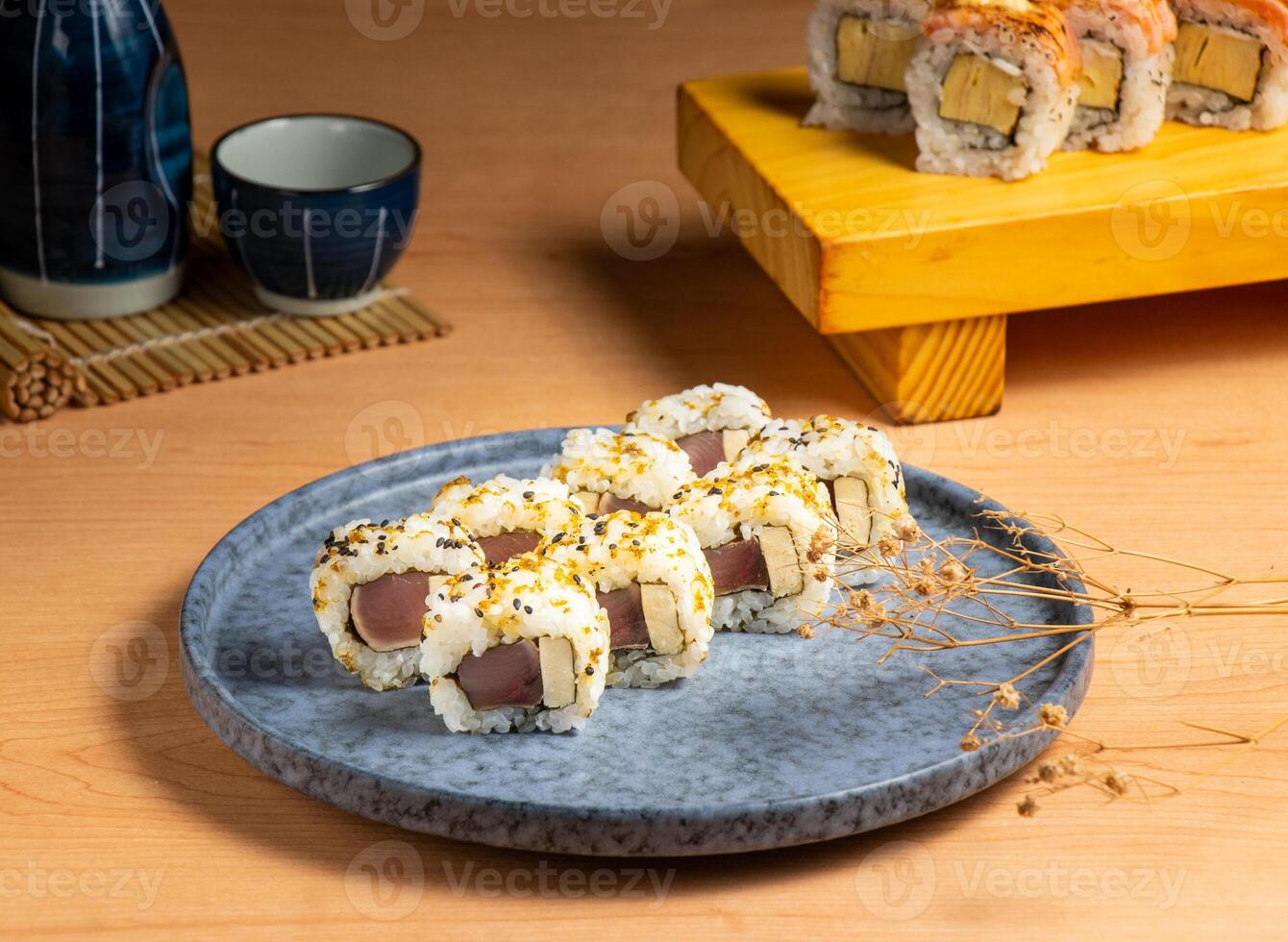 Smoked Bonito Sushi Rolls served isolated on wooden board top view of japanese food photo