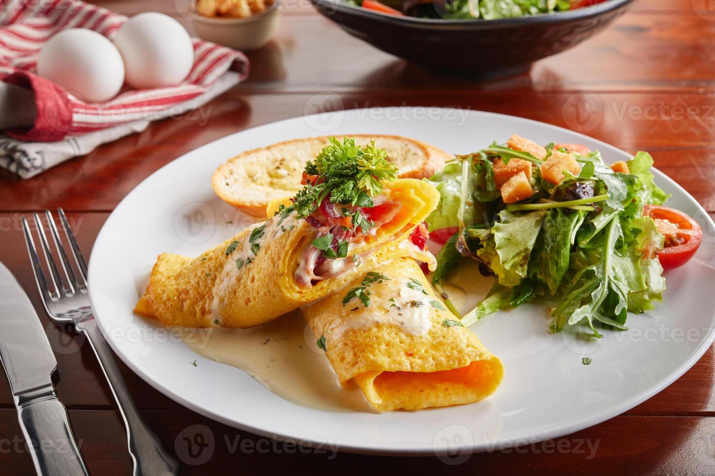 Egg Rolled with salad served in a dish isolated on wooden background side view photo