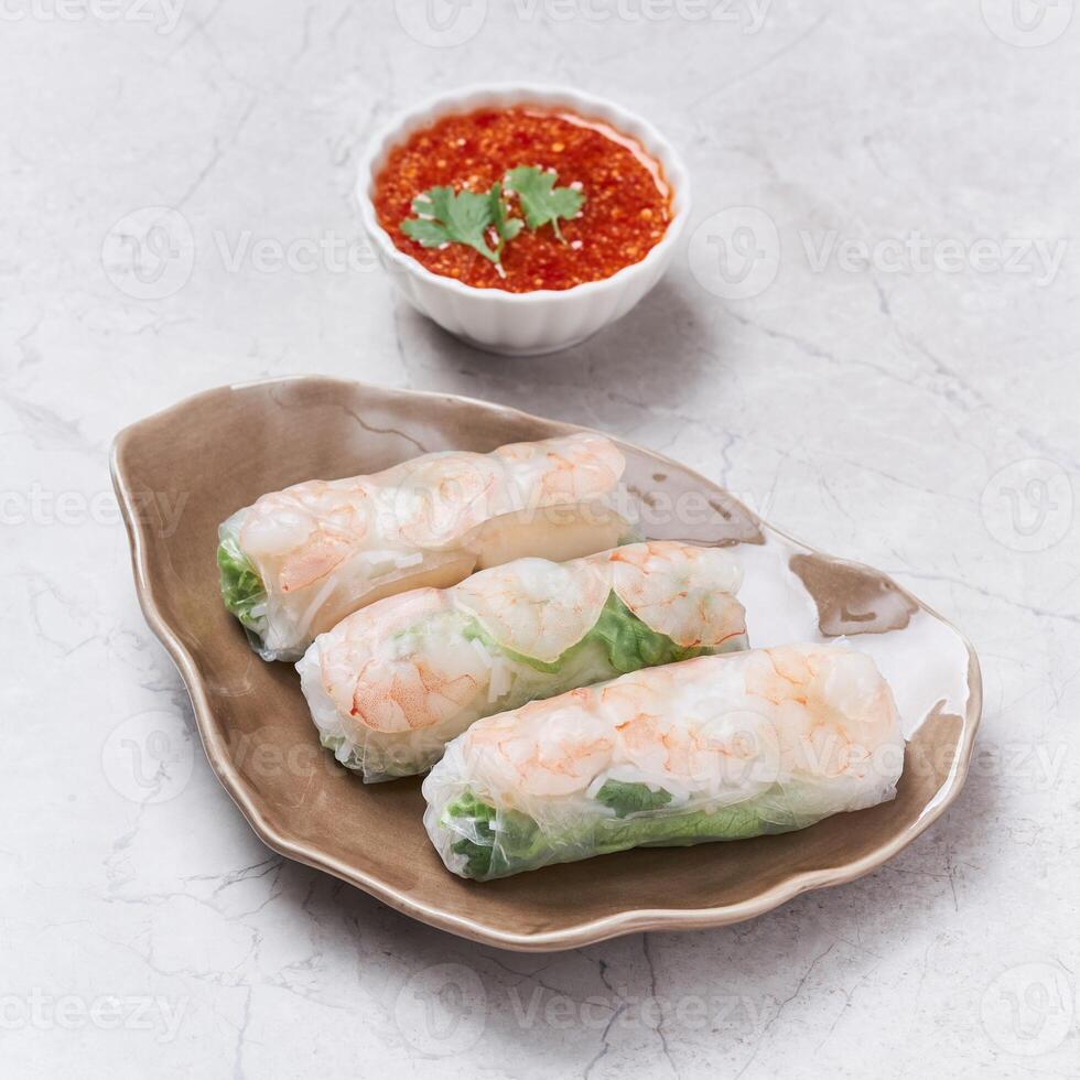 Fresh Spring Rolls with chili sauce served in a dish isolated on grey background side view of vietnam food photo