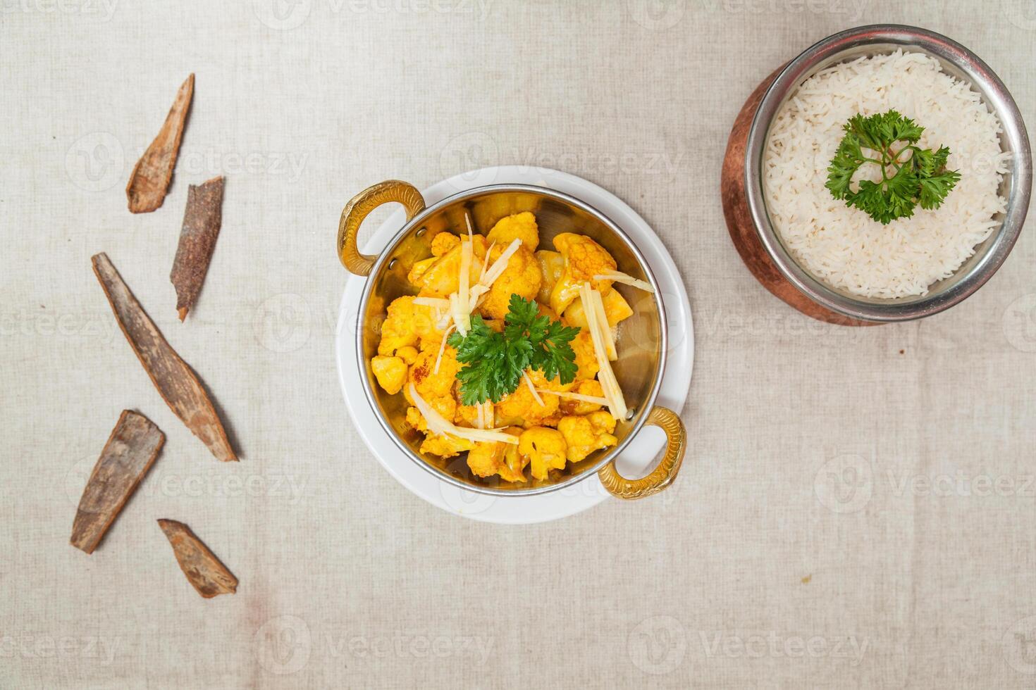Aloo gobi or potatoes cauliflower and served in a dish isolated on table top view of indian spices food photo