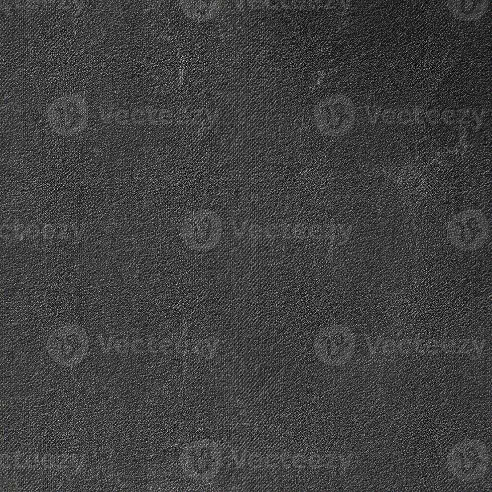 Texture of black matte plastic. Black background is rough plastic. photo