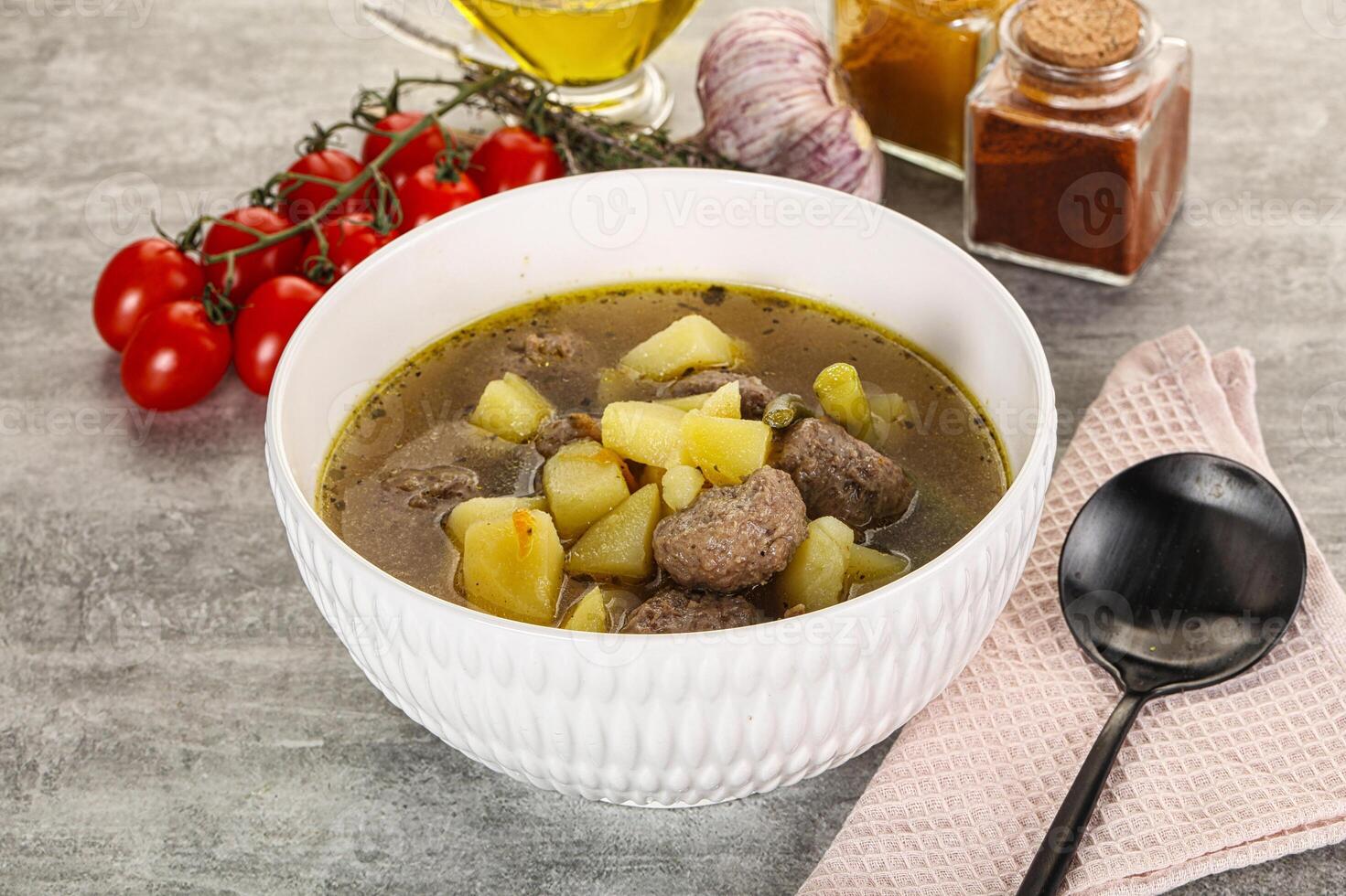 Soup with meatball and potato photo