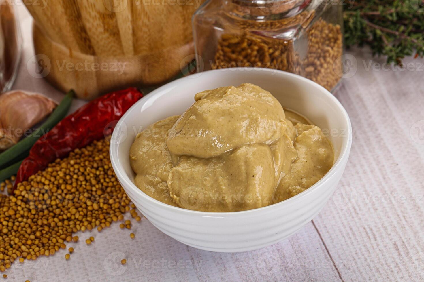 Dijon mustard sauce in the bowl photo