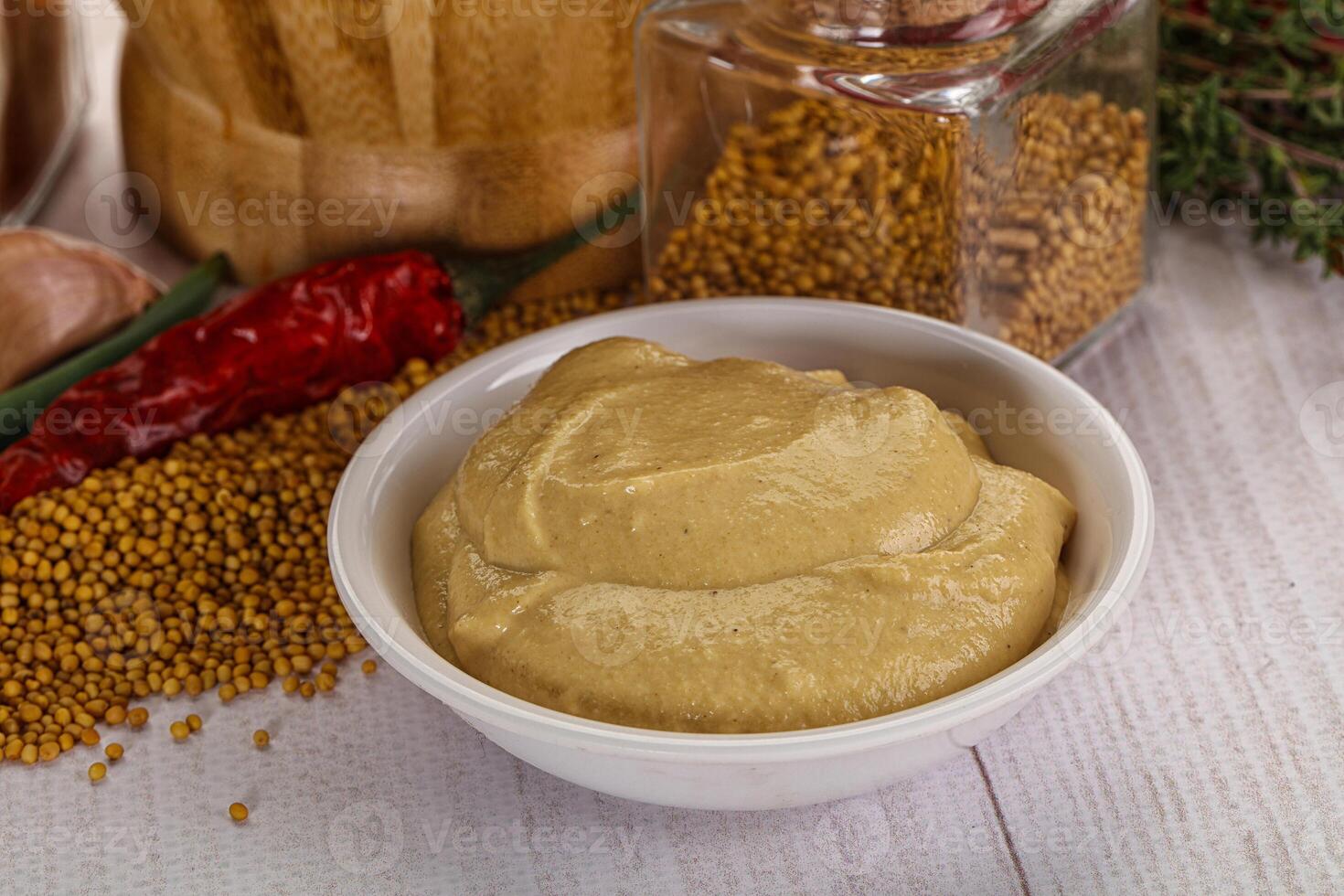 Dijon mustard sauce in the bowl photo