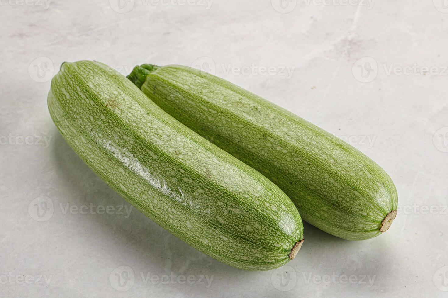 Raw green ripe zucchini vegetable photo