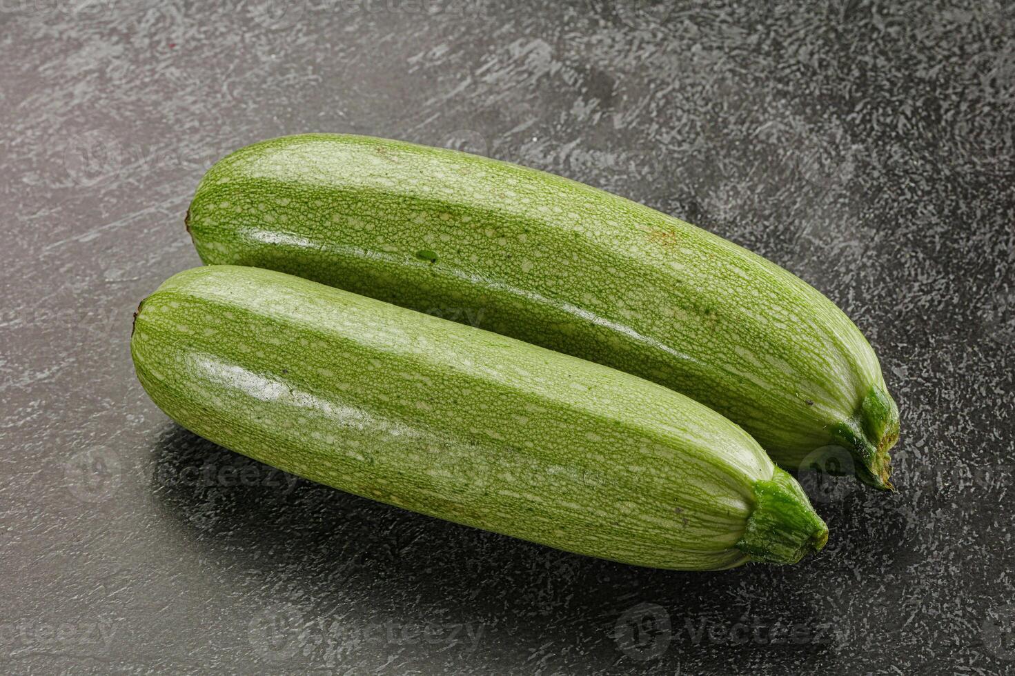 Raw green ripe zucchini vegetable photo
