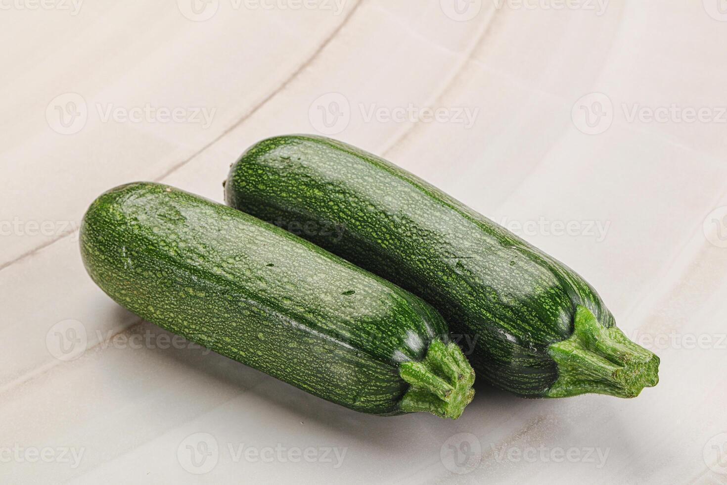 Raw green ripe zucchini vegetable photo