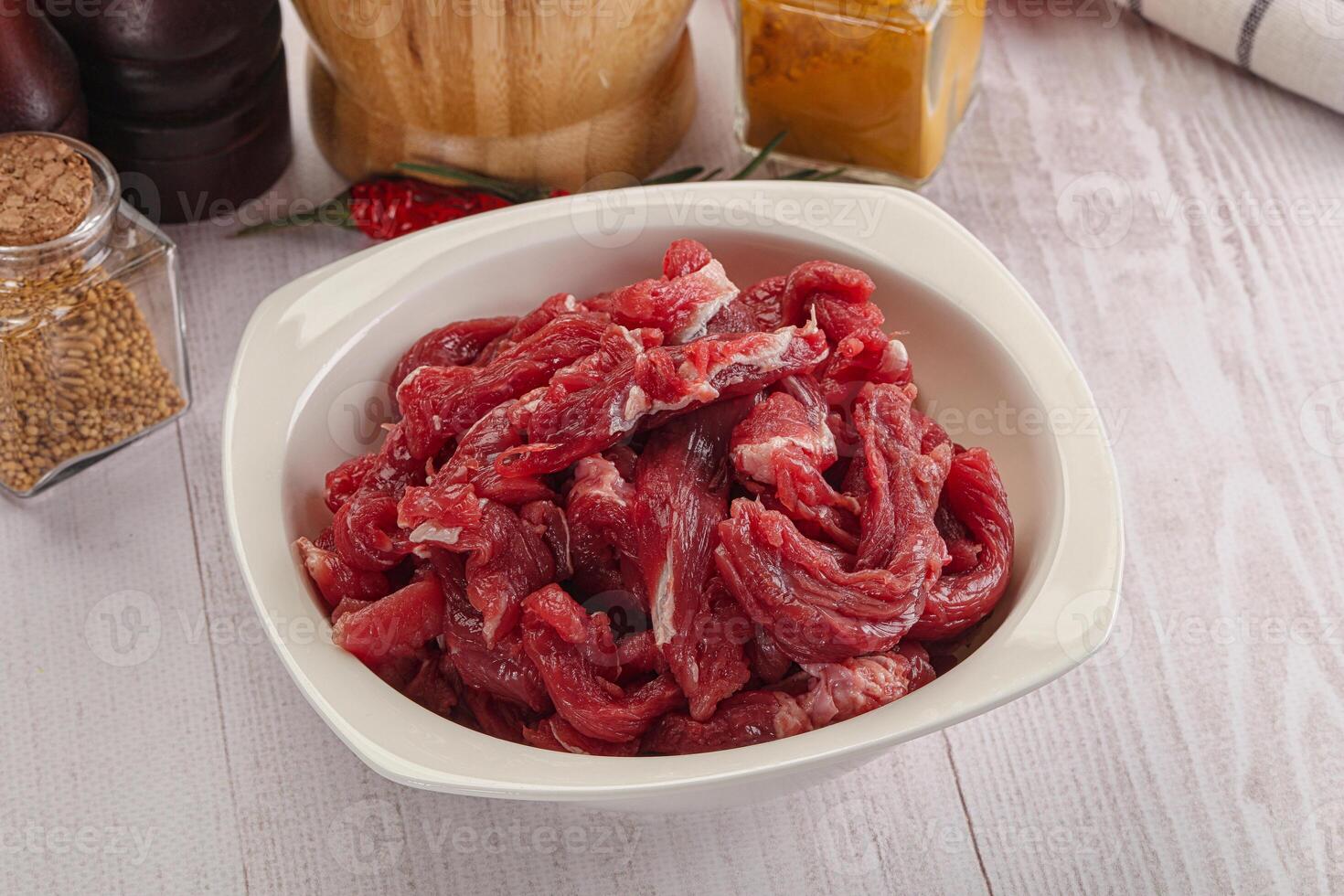 Raw beef meat - sliced strips photo