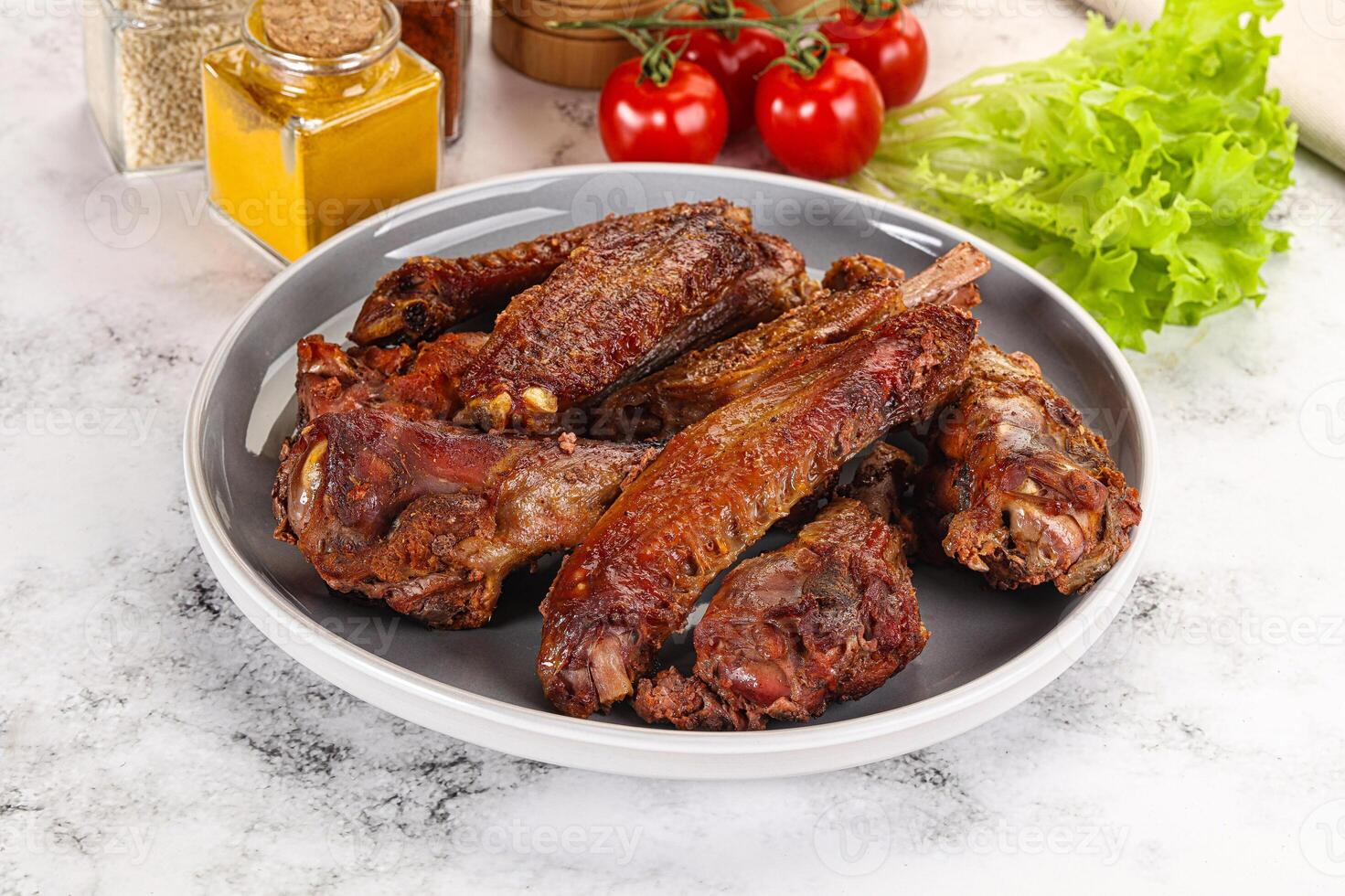 Roasted duck wings with sauce photo