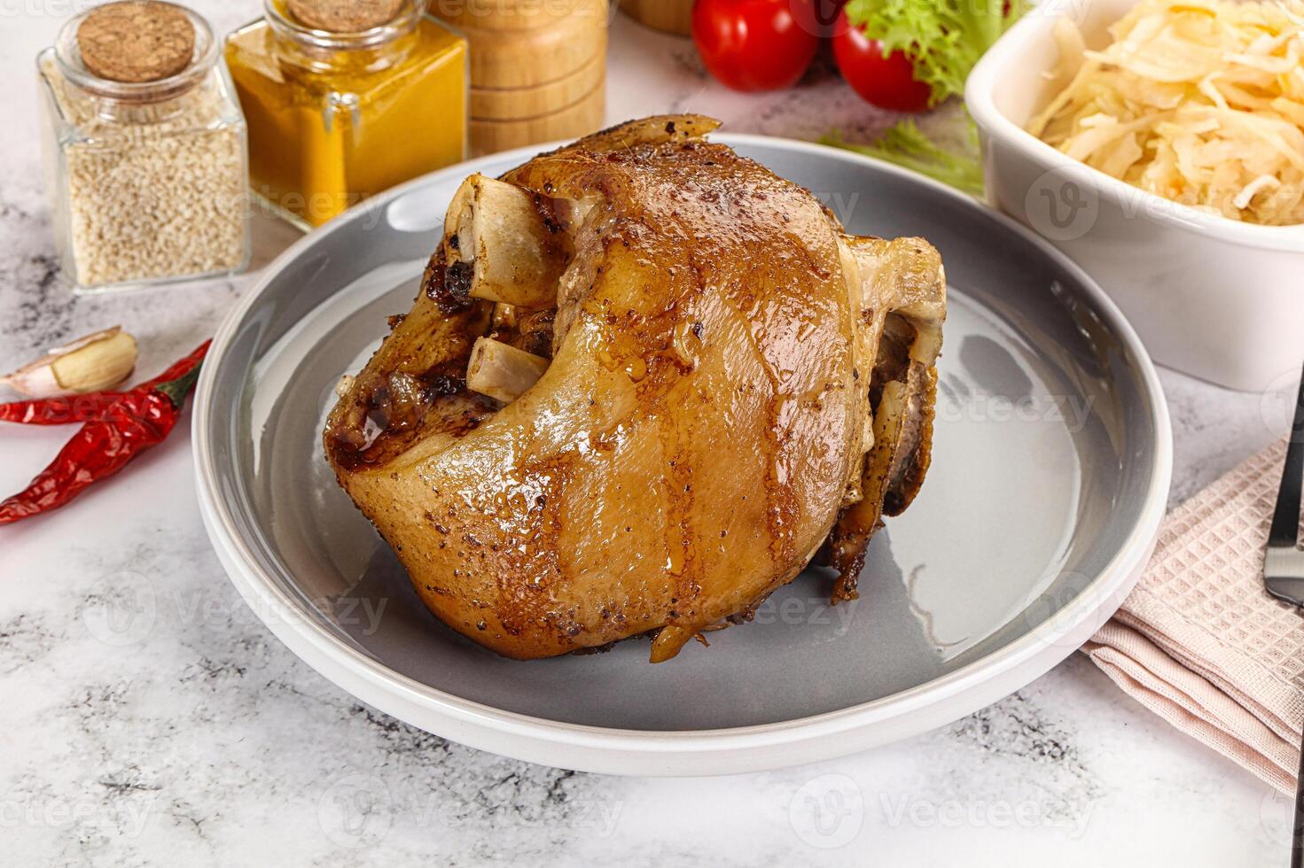 Baked pork knee with spices photo