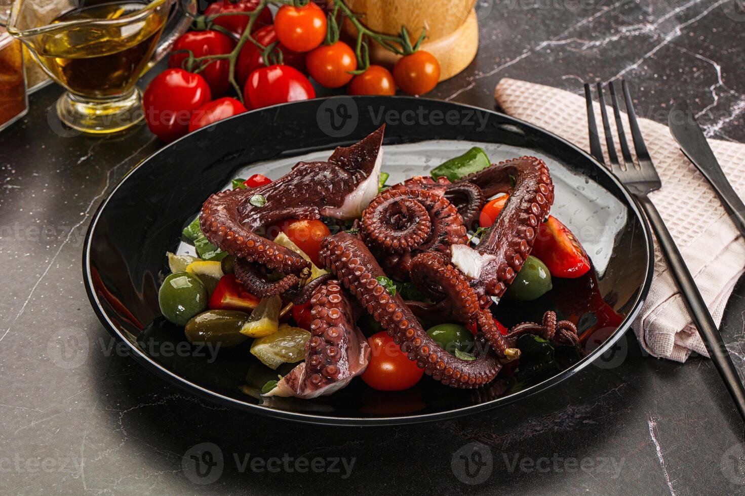 Salad with octopus tentacle and vegetables photo