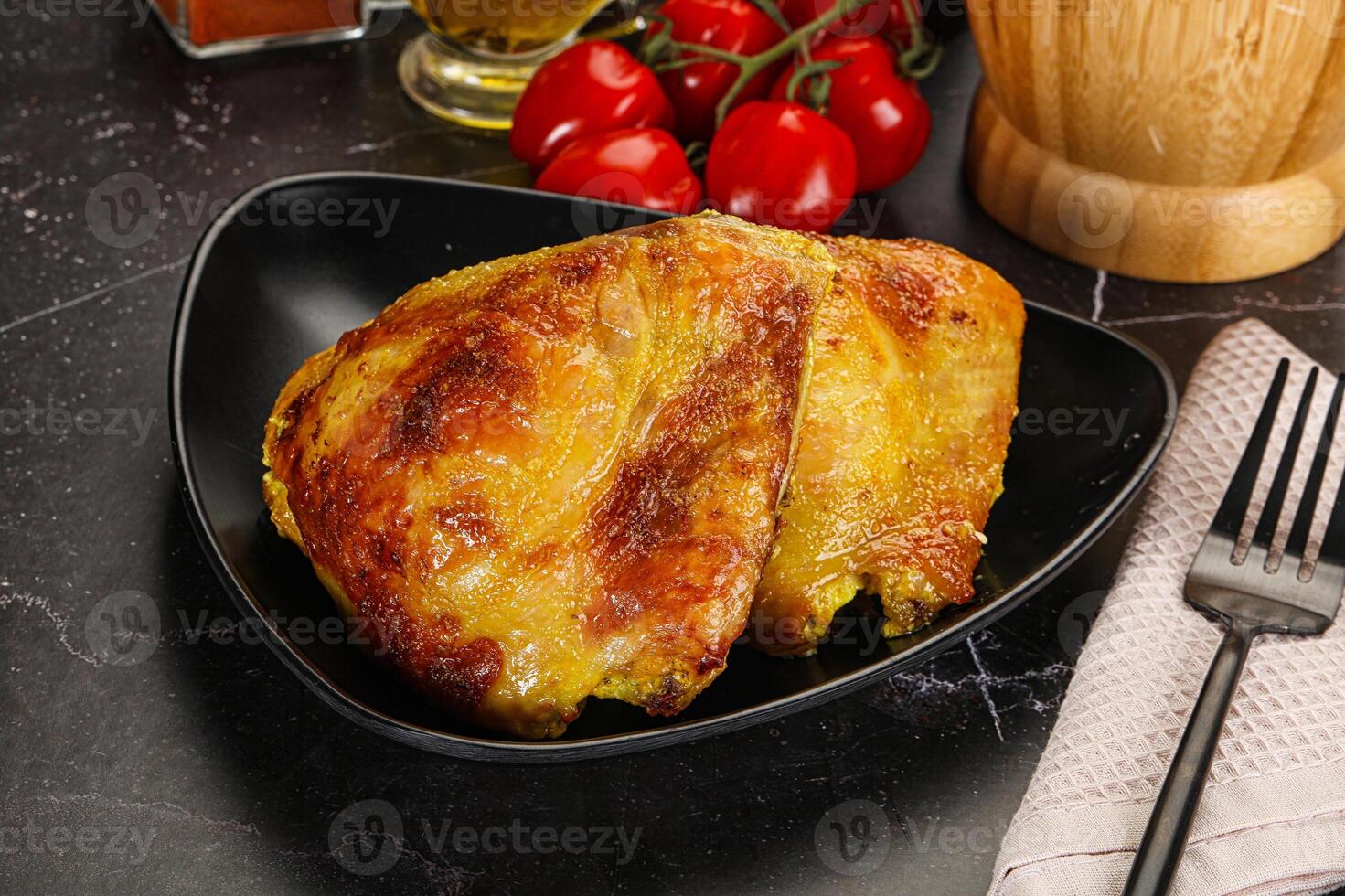 Roasted chicken thigh with spices photo