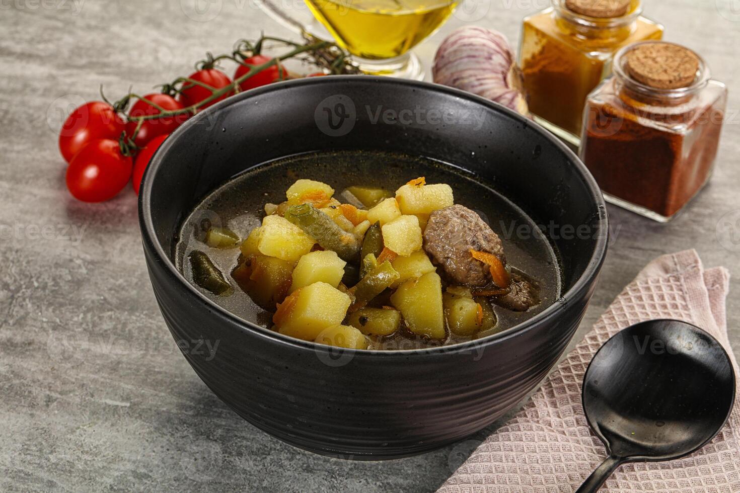 Soup with meatball and potato photo