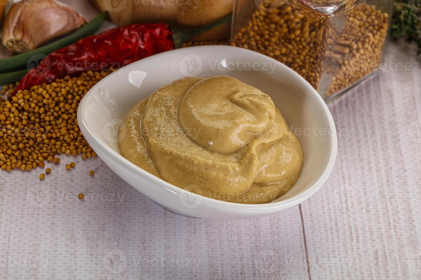 Dijon mustard sauce in the bowl photo