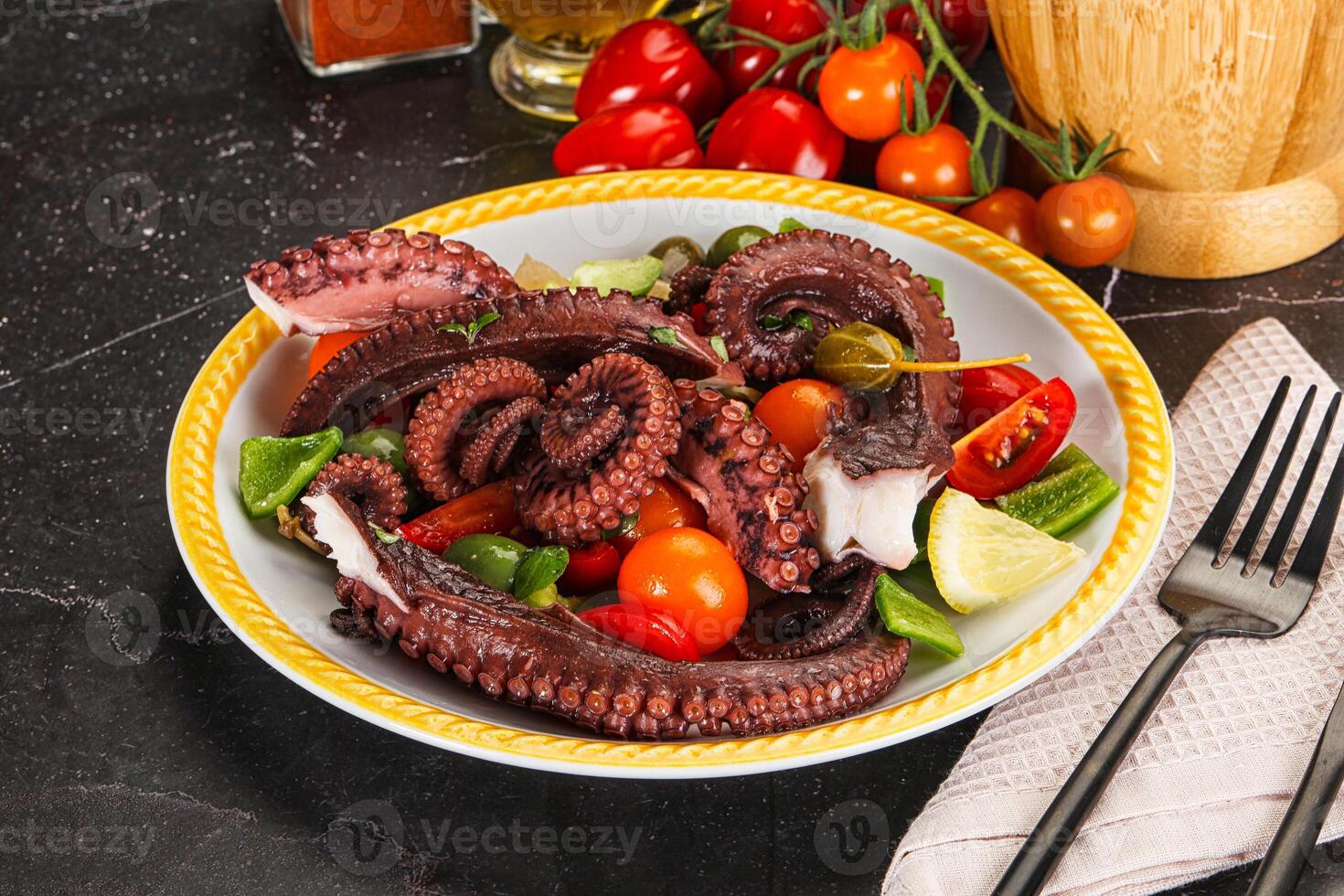 Salad with octopus tentacle and vegetables photo