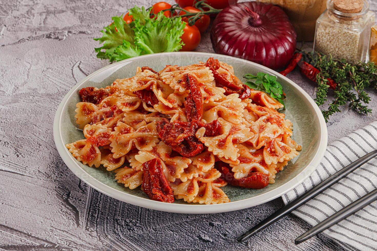 Pasta Farfalle with dry tomato photo