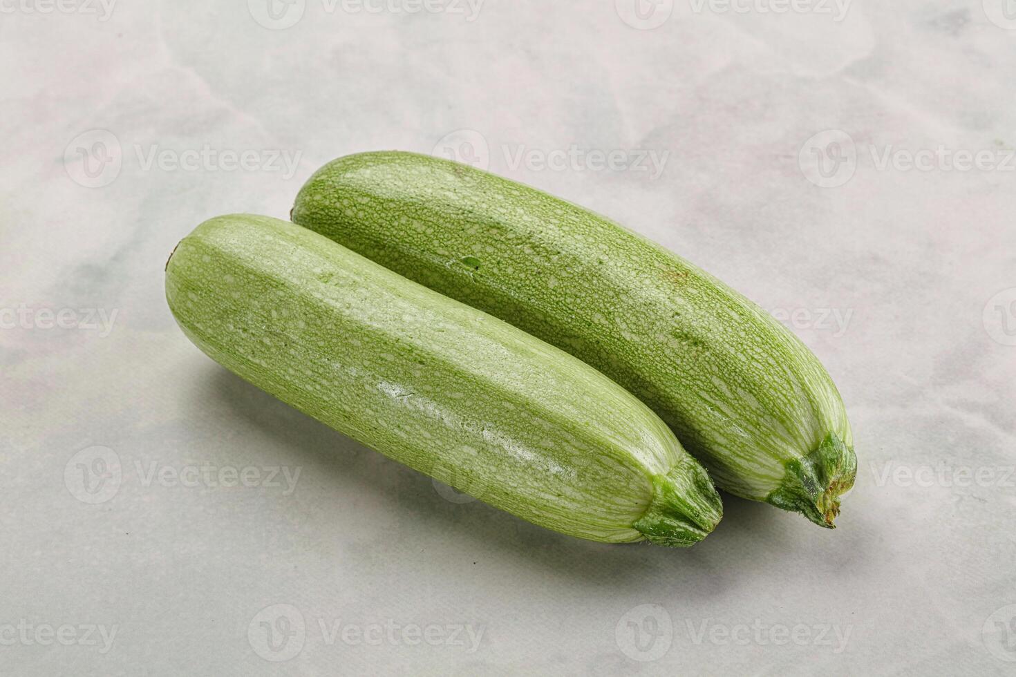 Raw green ripe zucchini vegetable photo