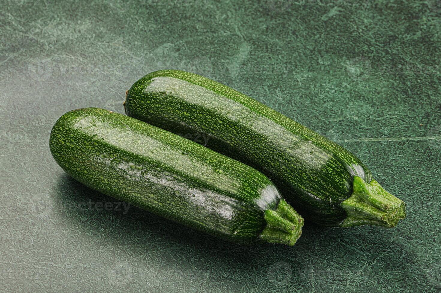 Raw green ripe zucchini vegetable photo