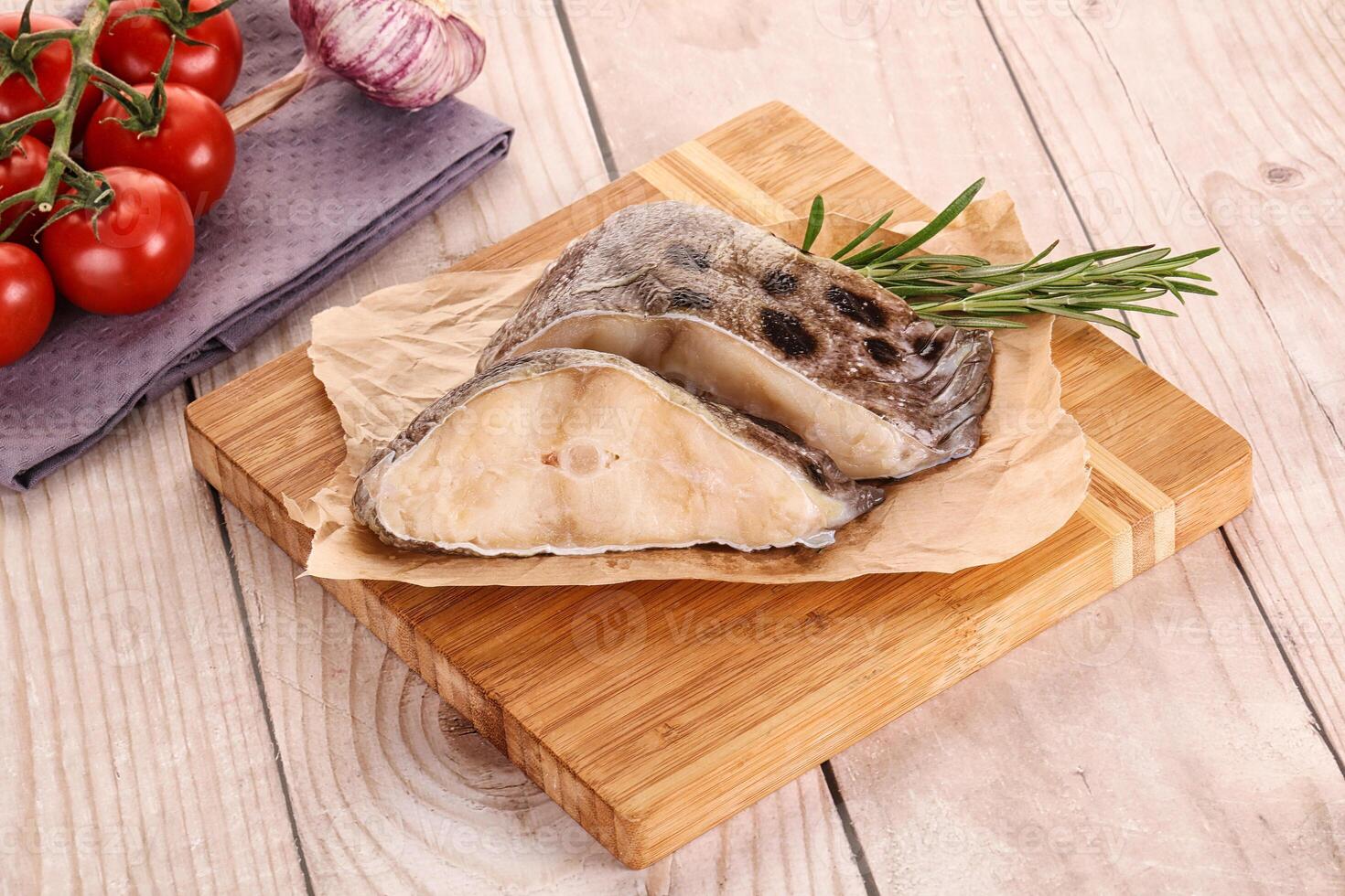 Raw wolffish steak for cooking photo