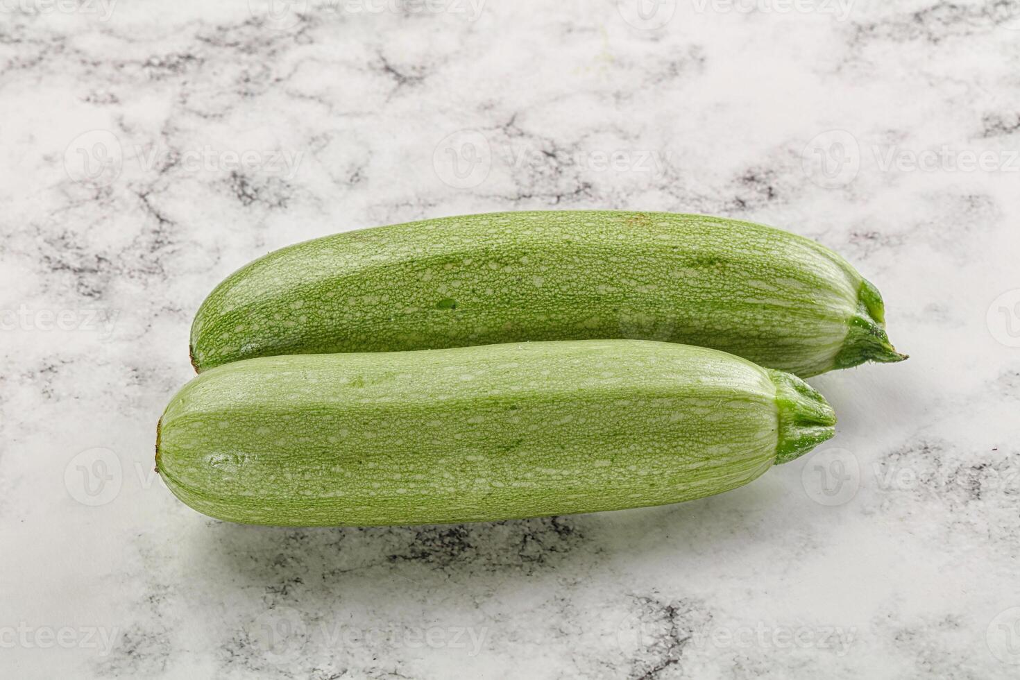 Raw green ripe zucchini vegetable photo