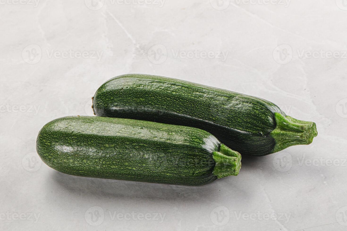 Raw green ripe zucchini vegetable photo