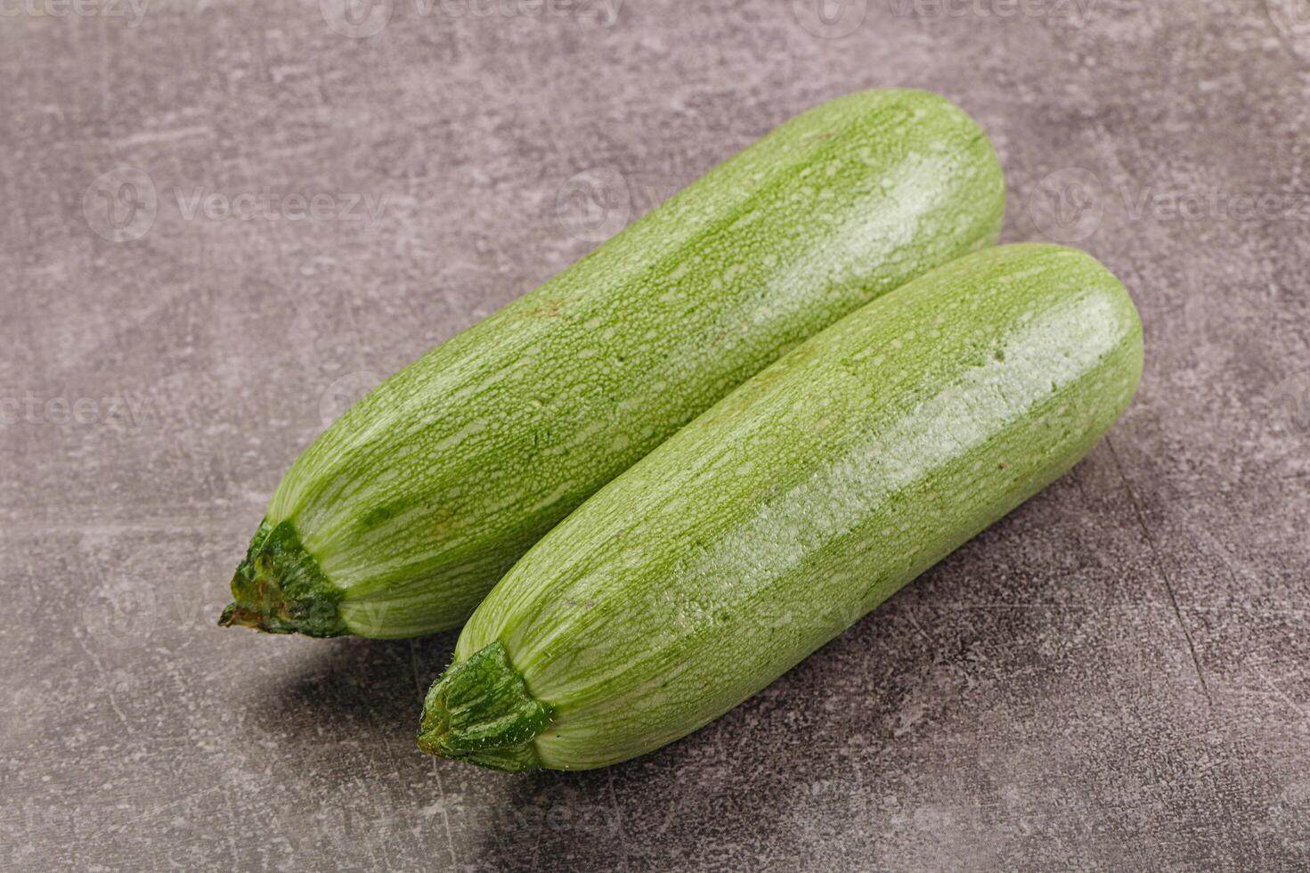 Raw green ripe zucchini vegetable photo