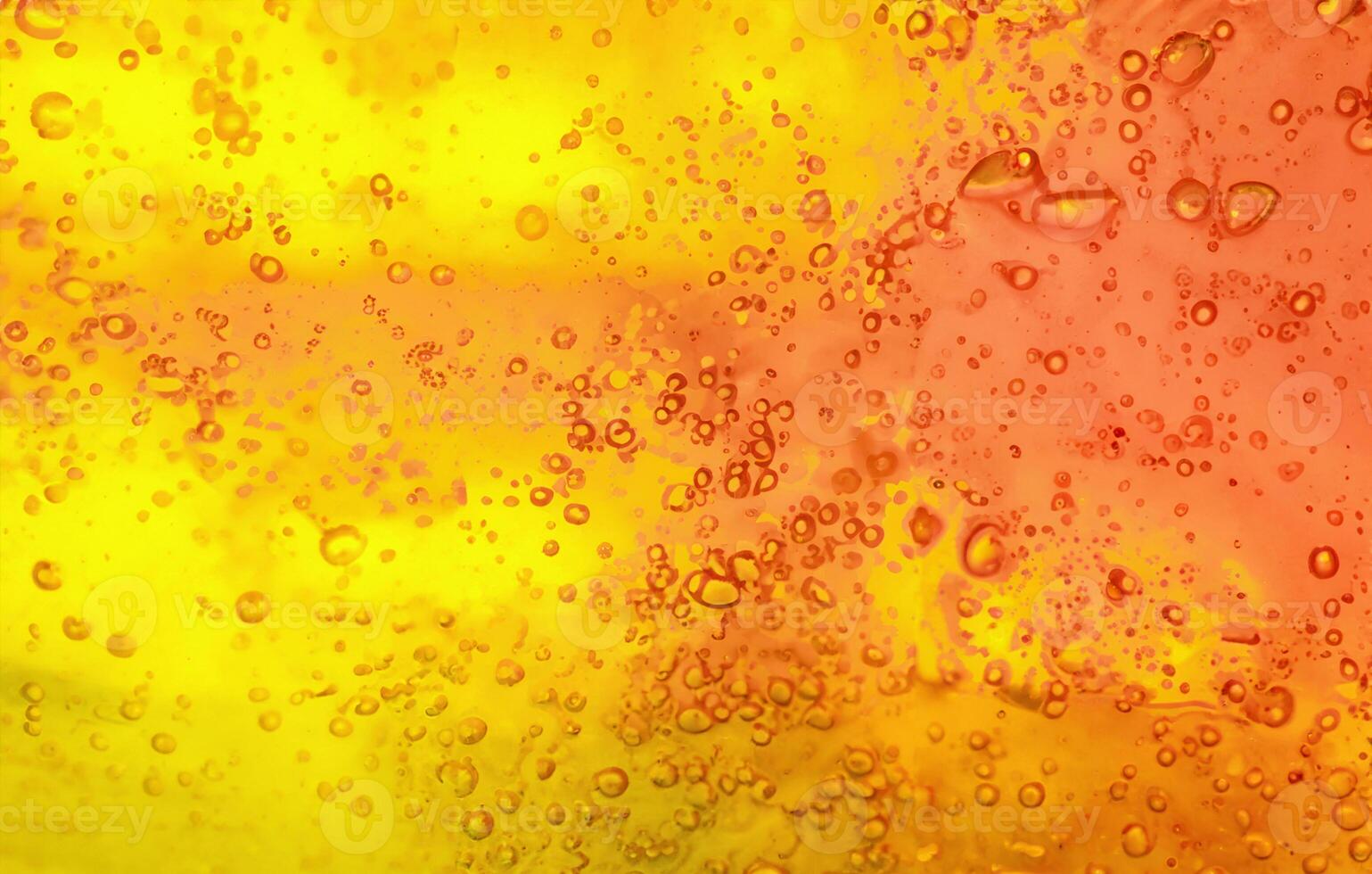 Bubbling Brilliance, Vibrant Gel Background with Abstract Texture in Yellow and Orange. photo
