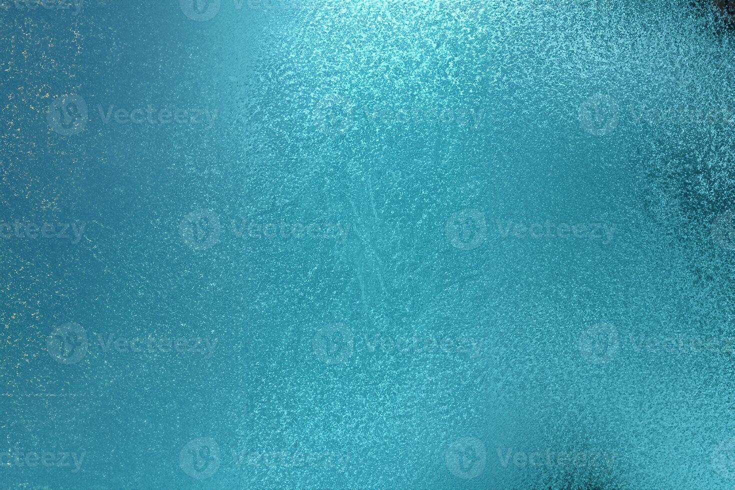 Brilliant teal metal wall texture with an abstract pattern backdrop. photo