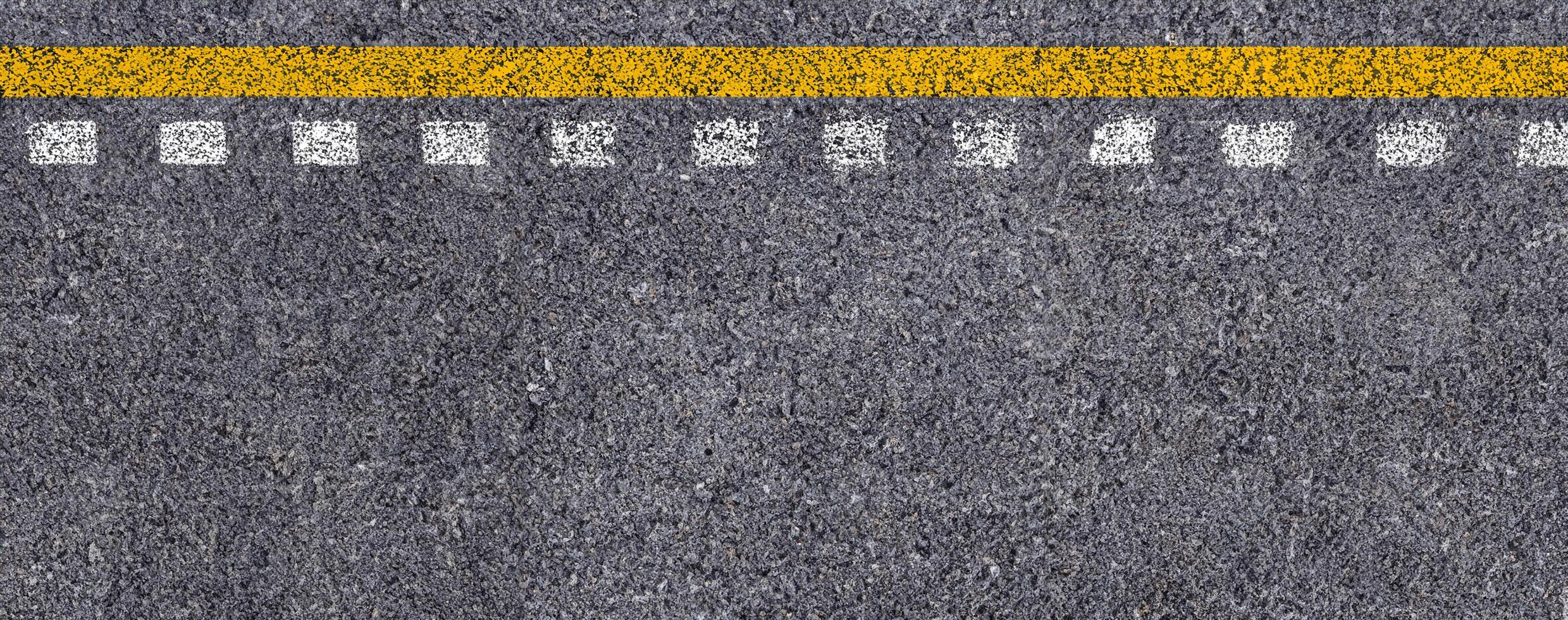 Top View of Double Yellow and White Lines on Asphalt Road Texture Background. photo