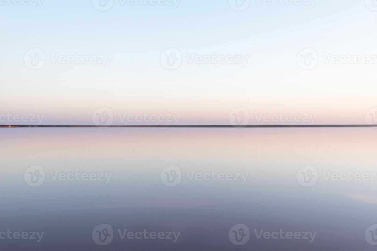 Tranquil Minimalist Landscape, Smooth Surface of Pink Salt Lake photo