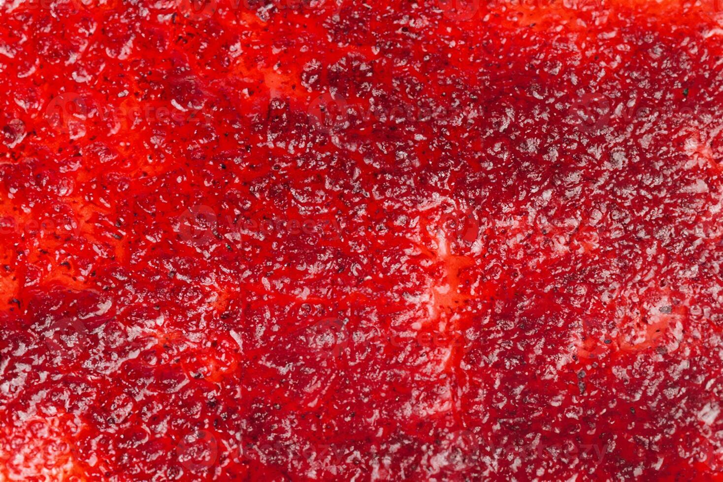 Top View of Vibrant Red Jam Spread, Perfect Background. photo