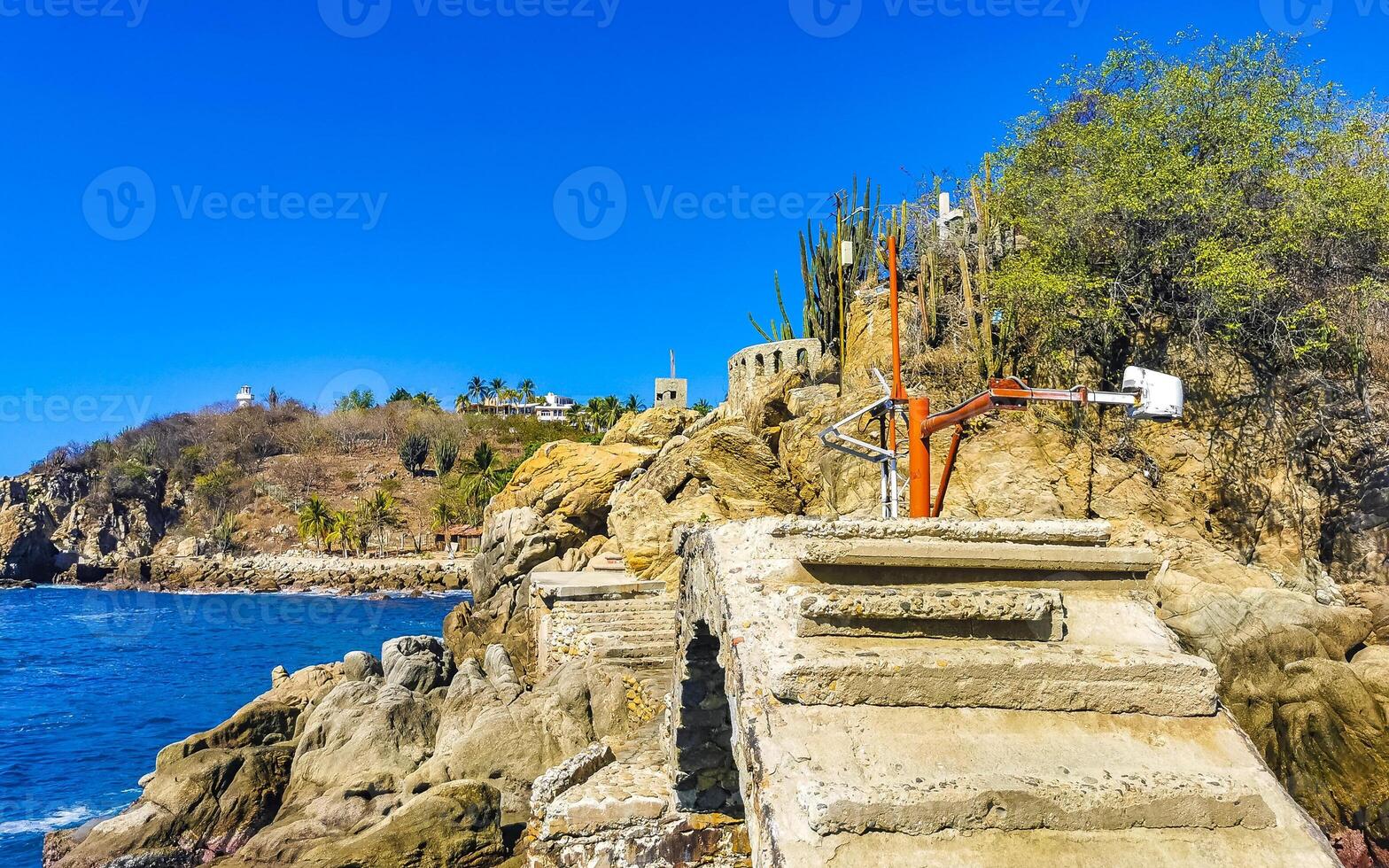 Beautiful rocks cliffs view waves at beach coast panorama Mexico. photo