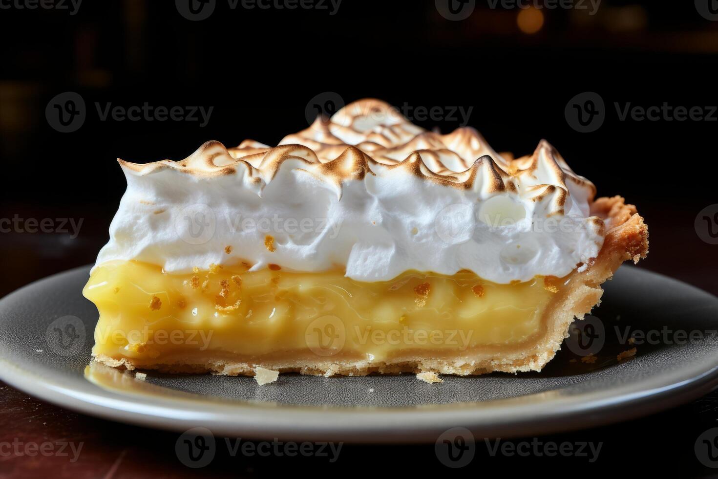 ai generado un rebanada de clásico limón merengue tarta con un dorado cima. generativo ai foto