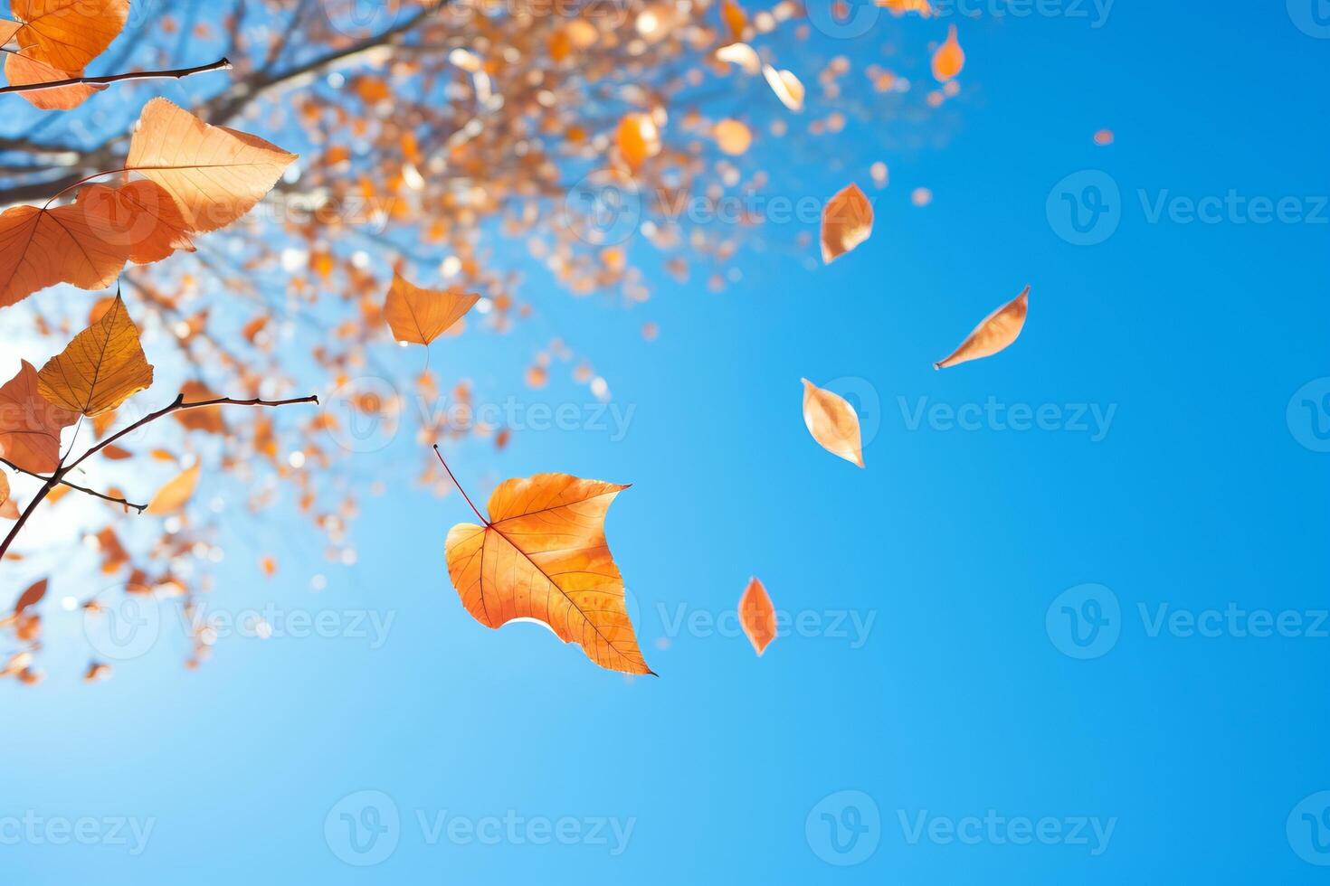 AI generated A dynamic shot of leaves falling from a tree against a brilliant blue sky. Generative AI photo