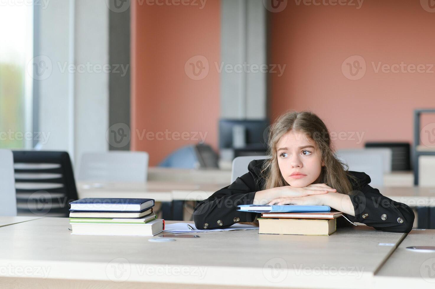 education and school concept - student girl studying and reading book at school. photo