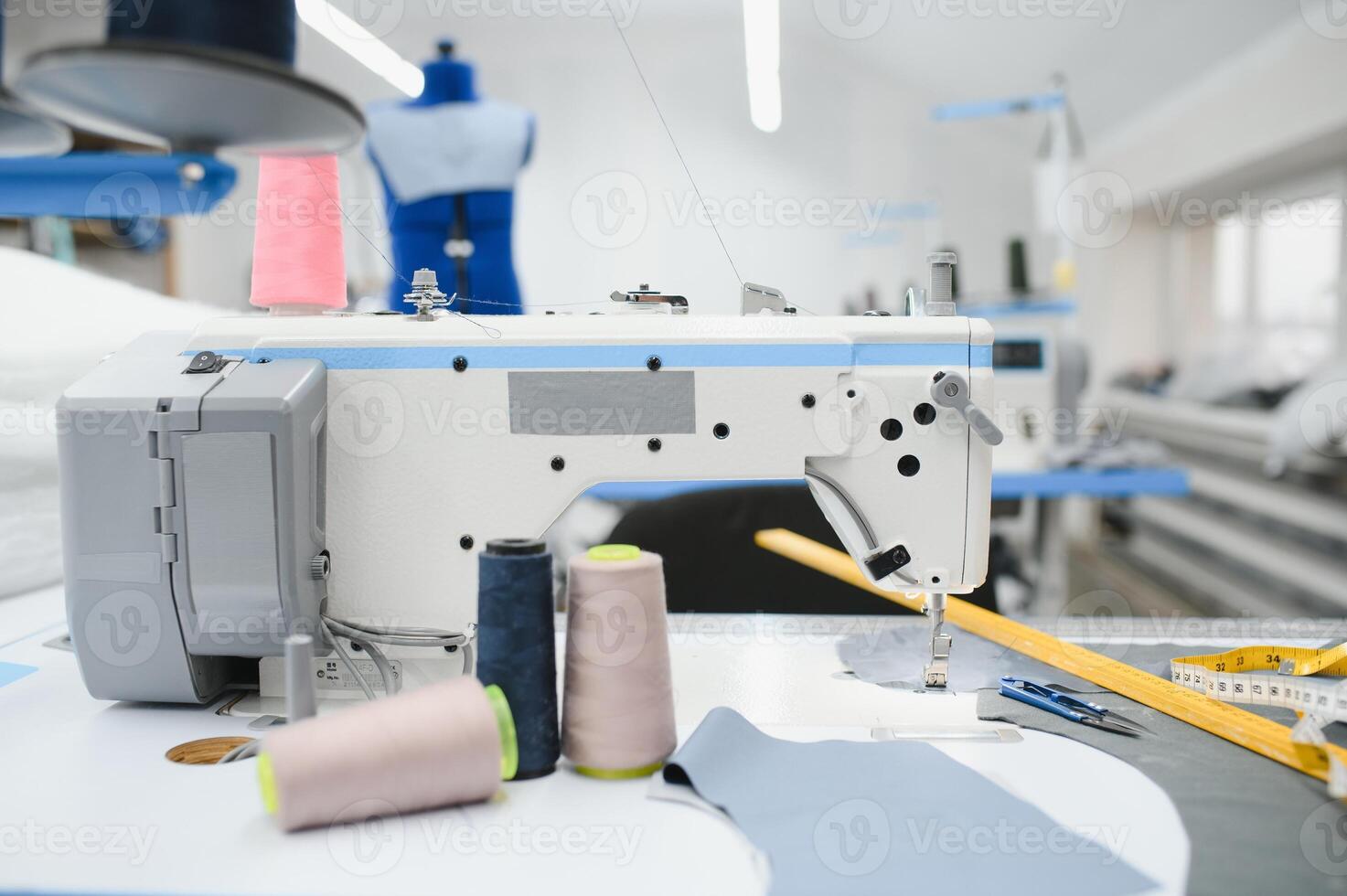 sewing supplies on the table next to the sewing machine photo